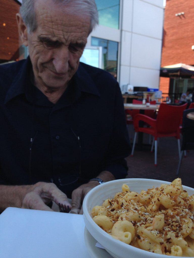 Older man with macaroni and cheese