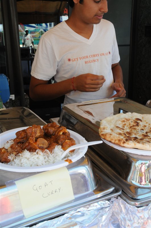 man selling goat curry with rice and naan at Festival of South Asia