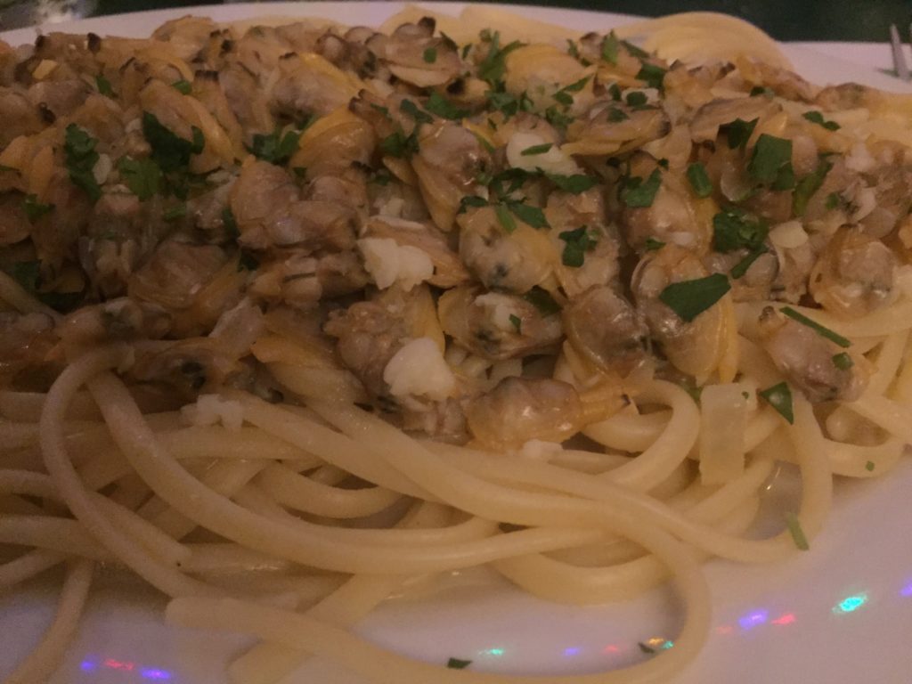 linguine vongole (linguini with clams) on a plate at Mona Lisa in San Diego
