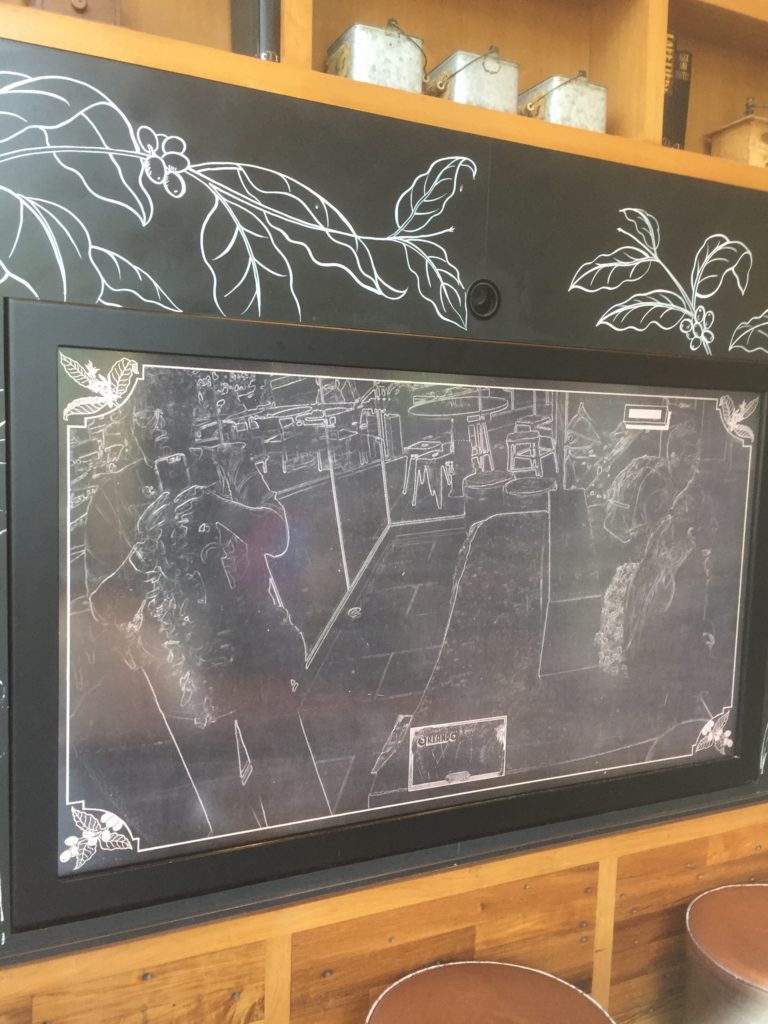 a "chalkboard" wall that changes video of patrons to chalk drawings