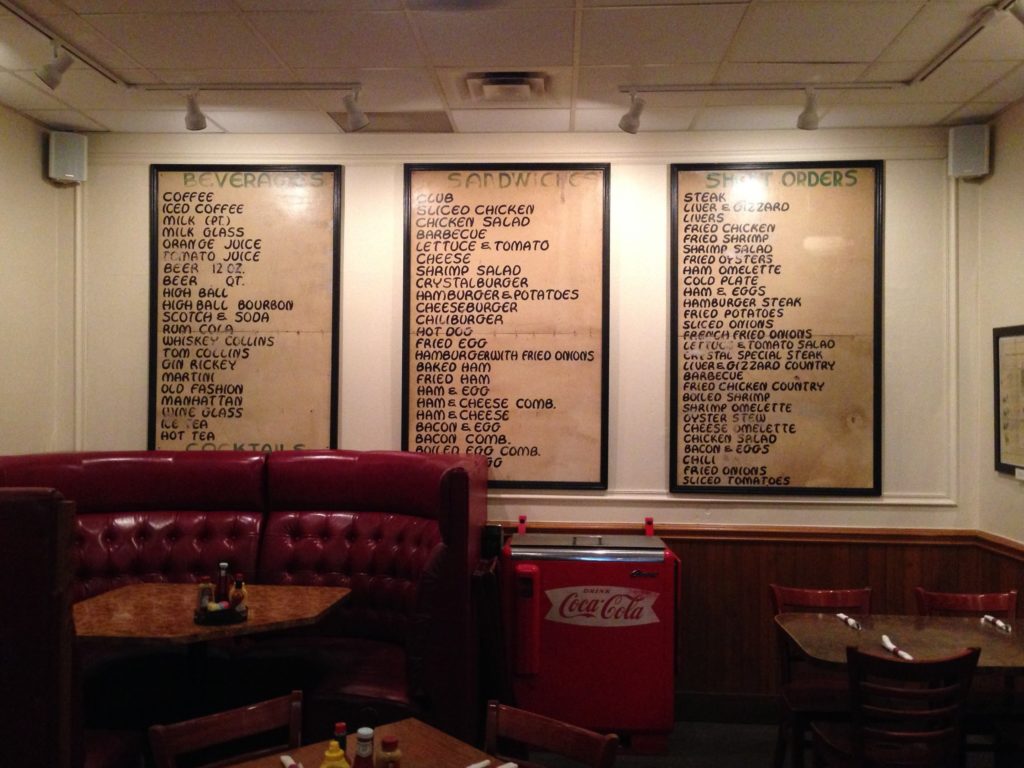 Restaurant interior with old menu boards on the wall
