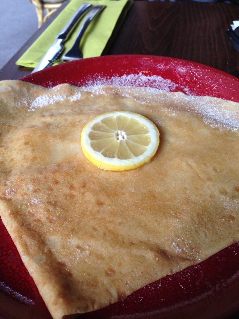 lemon crepe on a red plate