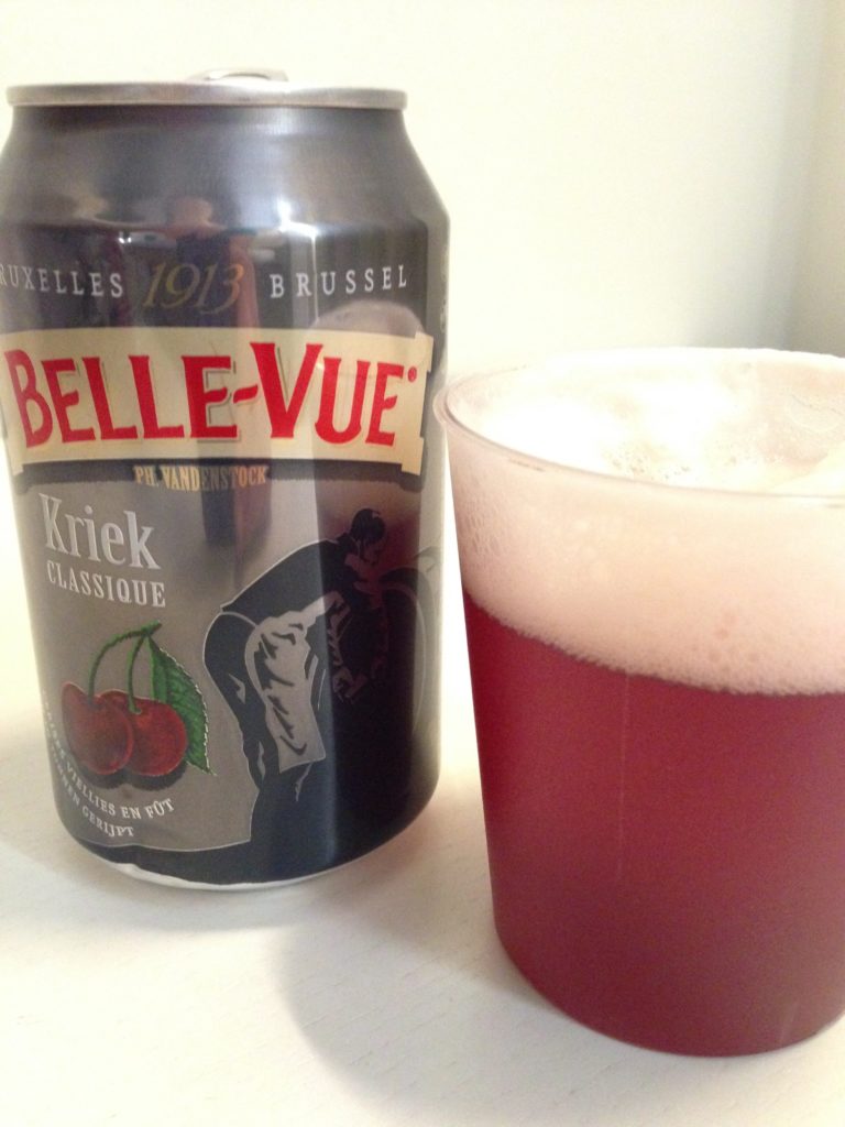 can of  Brussels belle-vue kriek beer and plastic cup of red beer