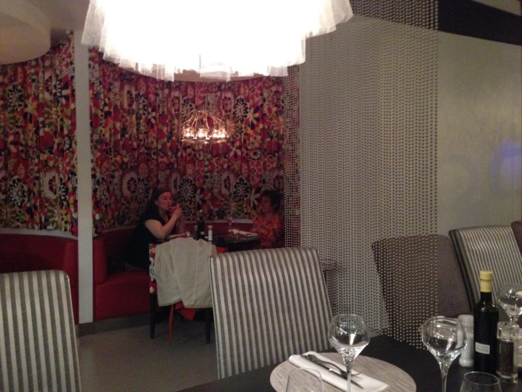 fancy upholstered red booth in the restaurant