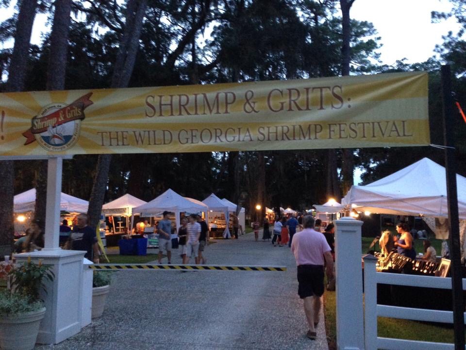 Entry to Shrimp and Grits Festival with welcome banner
