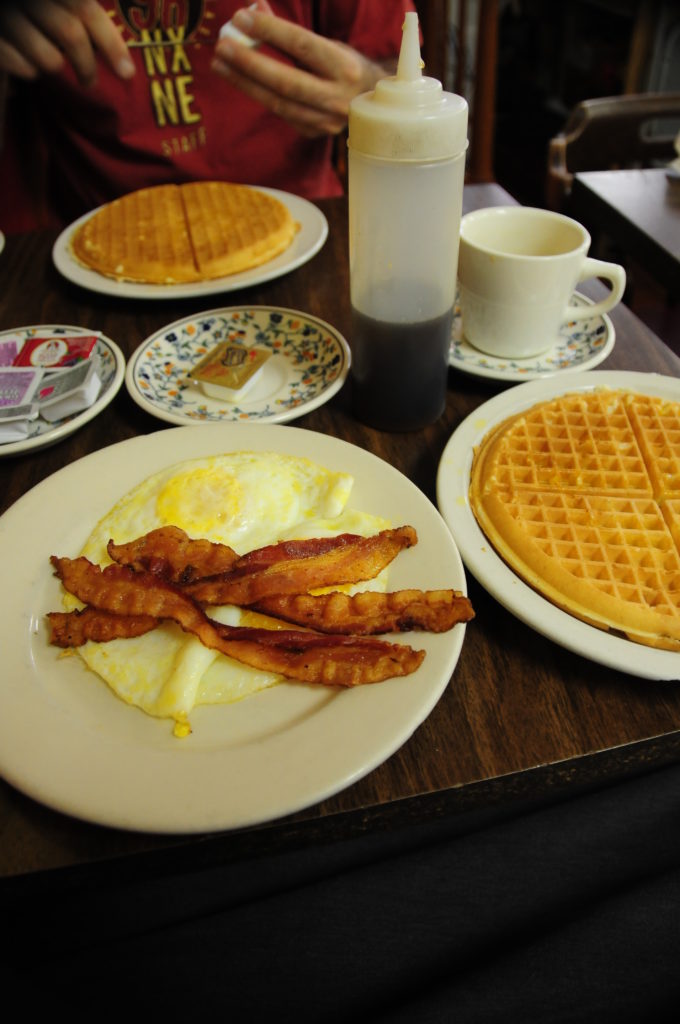 Breakfast at Lincoln's Waffle Shop - table with waffles, eggs and bacon