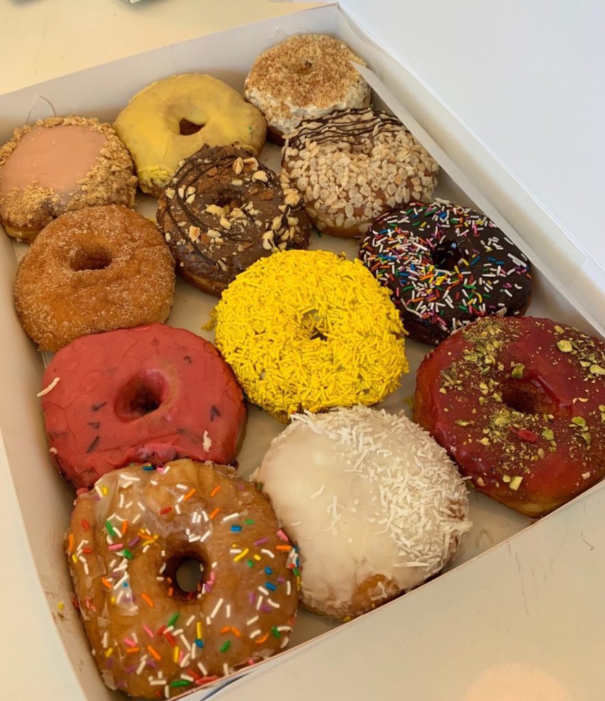 box of different flavour doughnuts