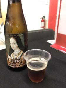 Duchesse du Borgogne beer bottle and sample cup at Yelp Night at the Markham Museum
