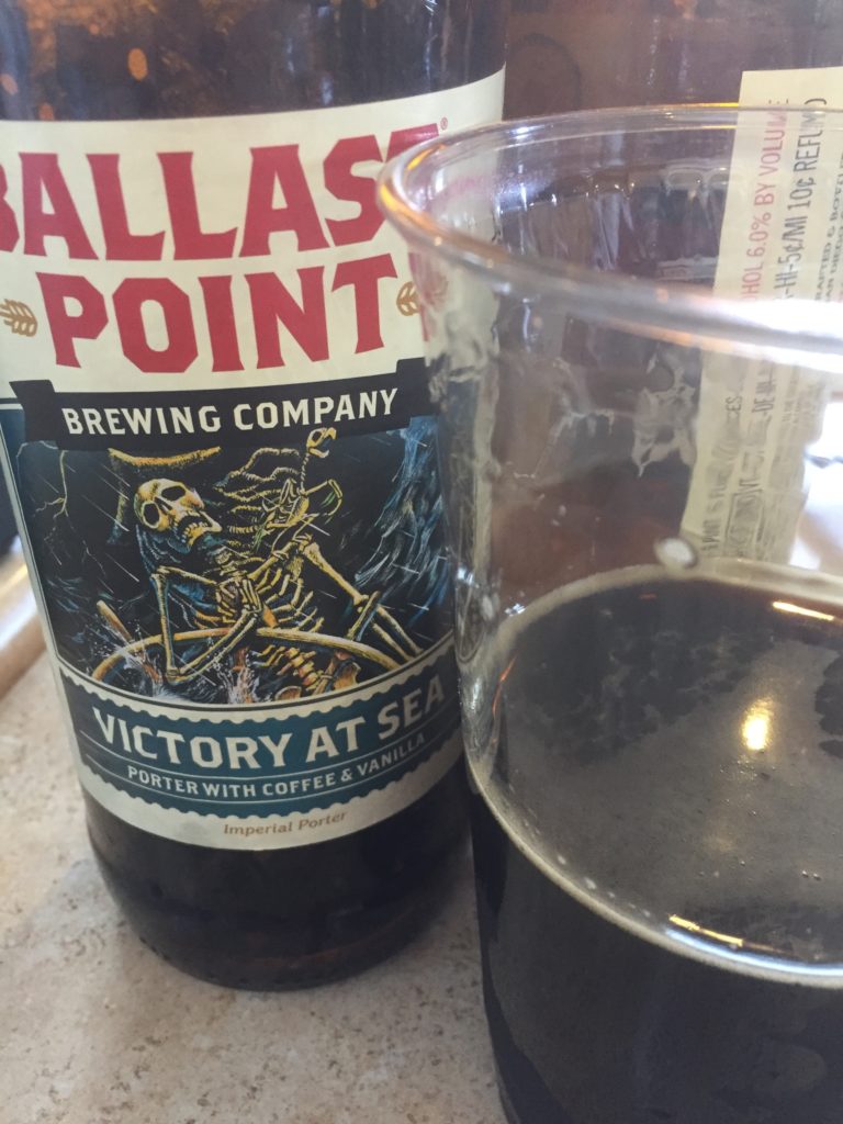 Ballast Point craft beer bottle and plastic glass