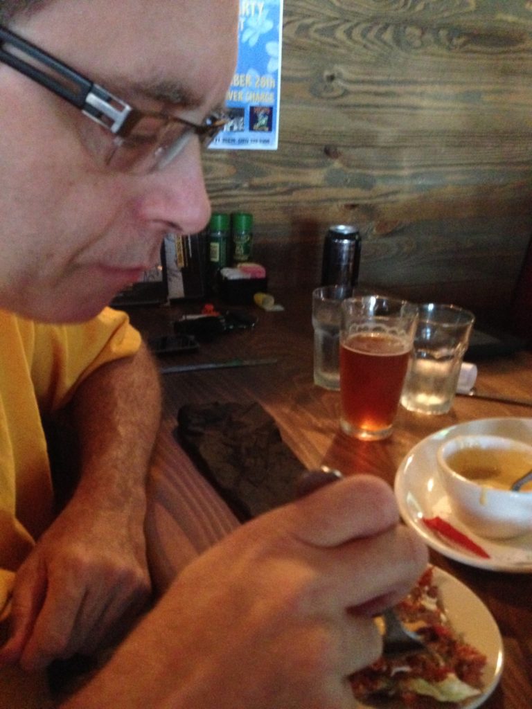 man eating at the table at Sea Dog Brewing Orlando