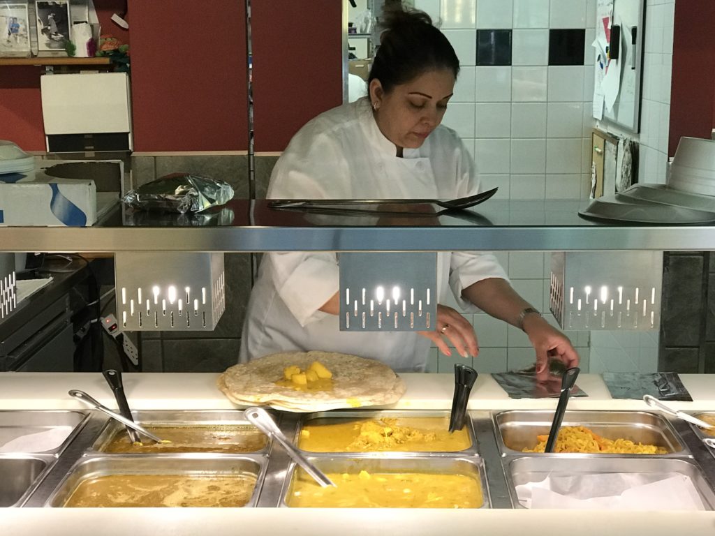 woman prepares roti