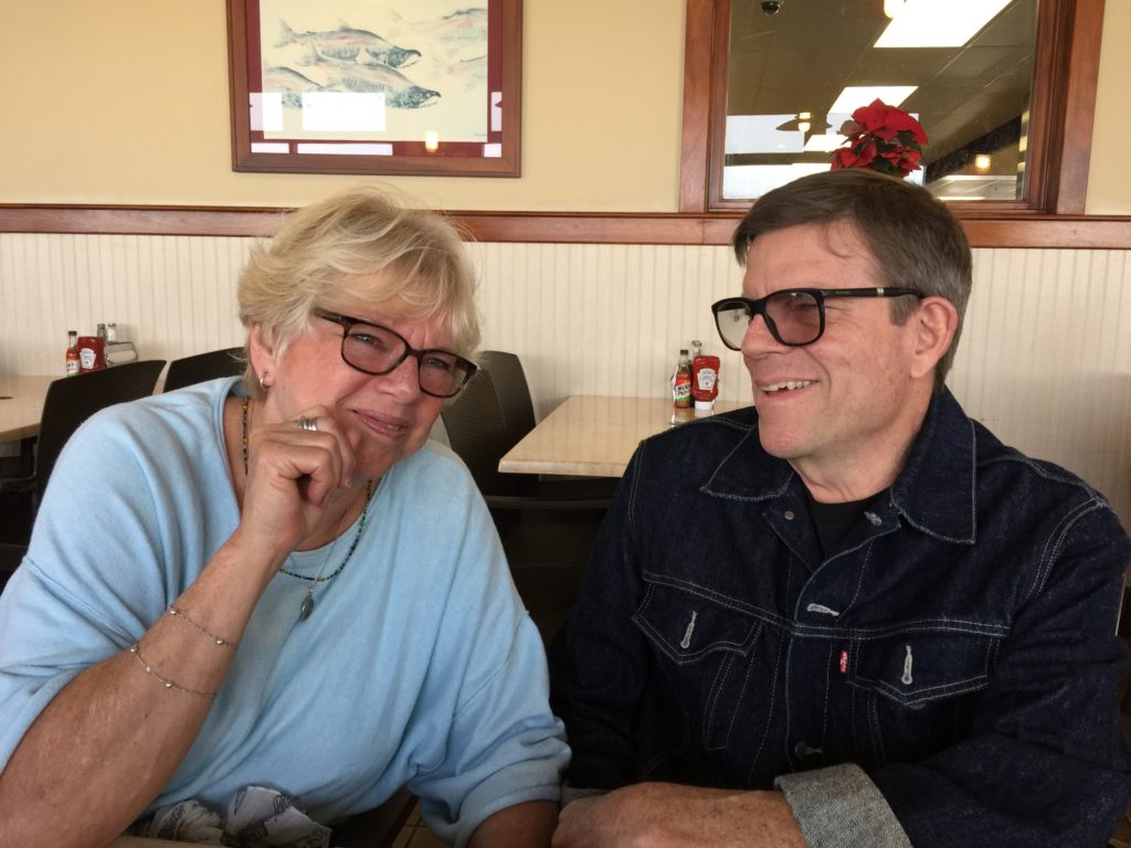 two people sit at one of theindoor tables 