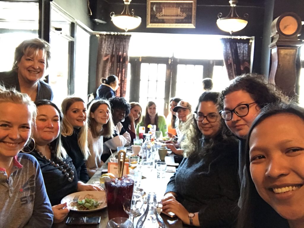 A large group at one long table at Nirvana