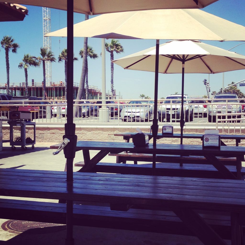 Outdoor dining tables with umbrellas