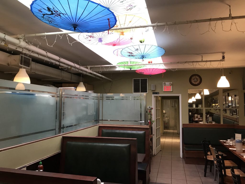 Table in Mother's Dumplings and skylight with umbrellas