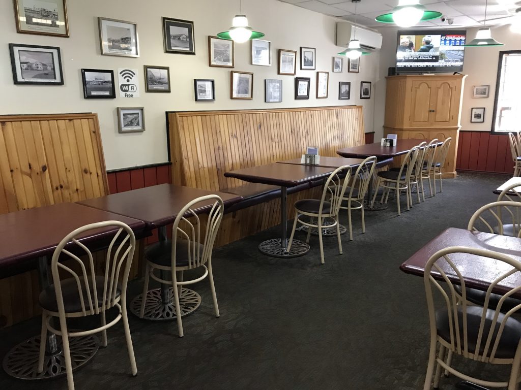 Interior with tables at Pizza Pino in Ajax