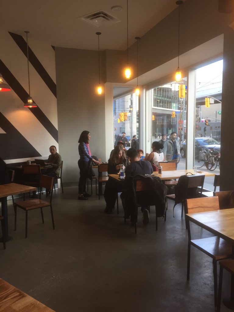 interior tables and chairs at Blaze Pizza in Toronto
