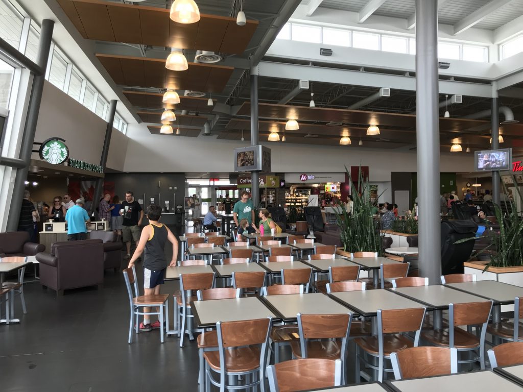 Starbucks at an ON Route with tables and chairs 